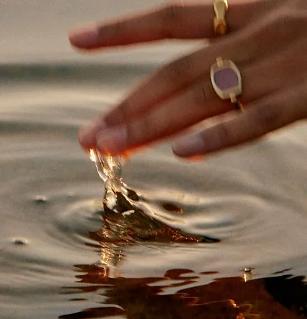 Hand touching water